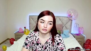 Big tits redhead strips to bra